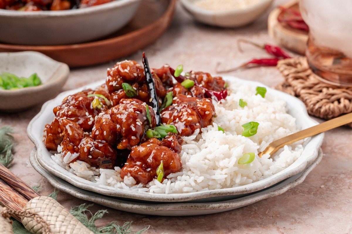 General Tso’s chicken served over steamed white rice with scallions and sesame seeds