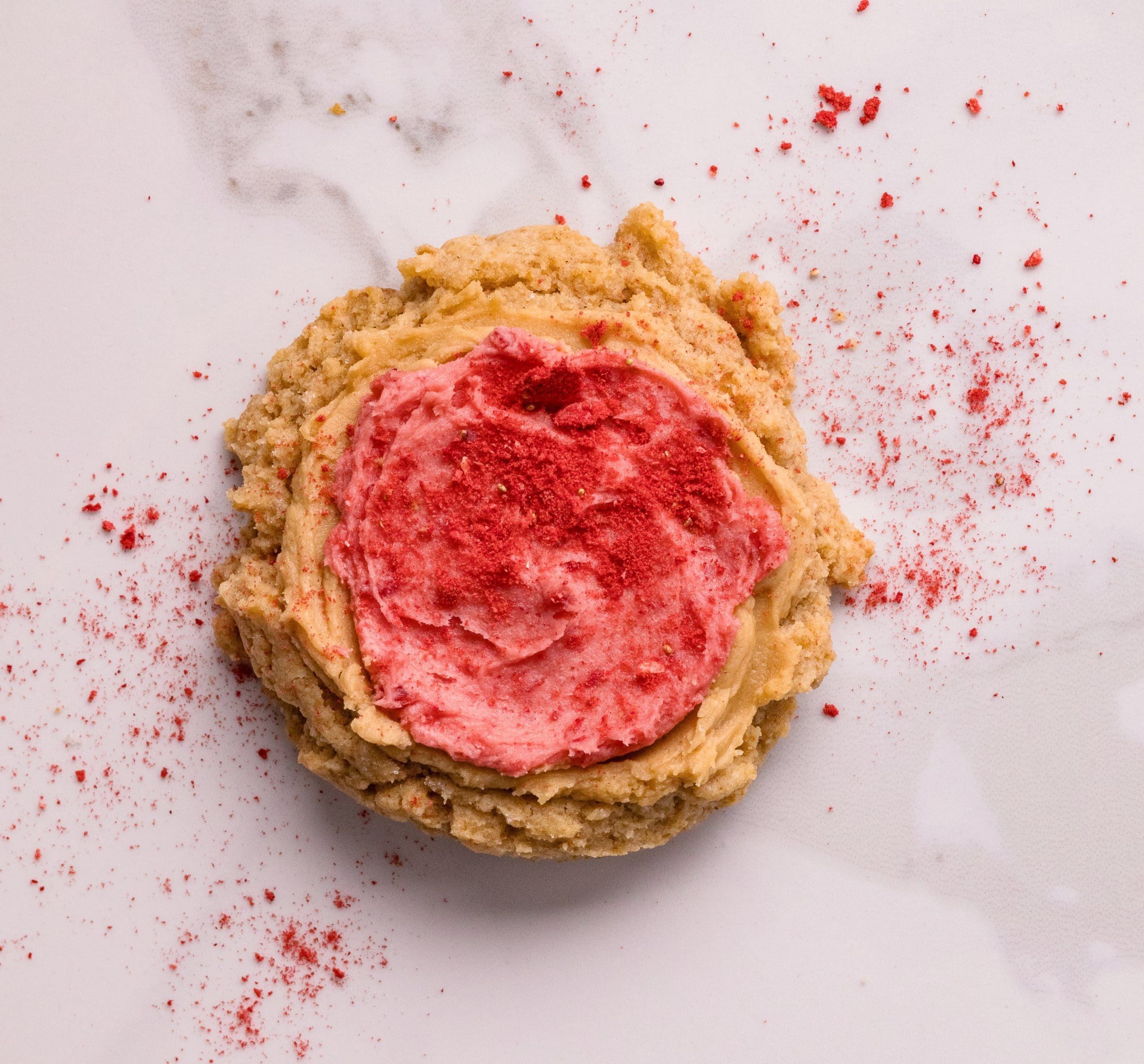 Biscoff Butter Cookie with Strawberry Frosting Biscoff butter cookie with strawberry frosting and strawberry powder on top