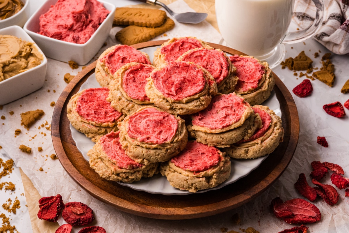 Biscoff Butter Cookies on a Plate Biscoff butter cookies on a plate with cookie butter and freeze-dried strawberries nearby