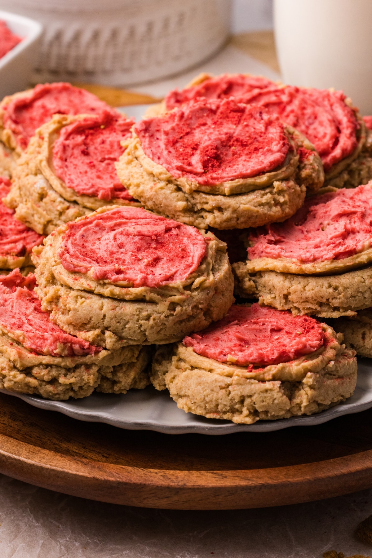 Biscoff Butter Cookies with Strawberry Frosting Biscoff butter cookies with strawberry frosting stacked on a plate
