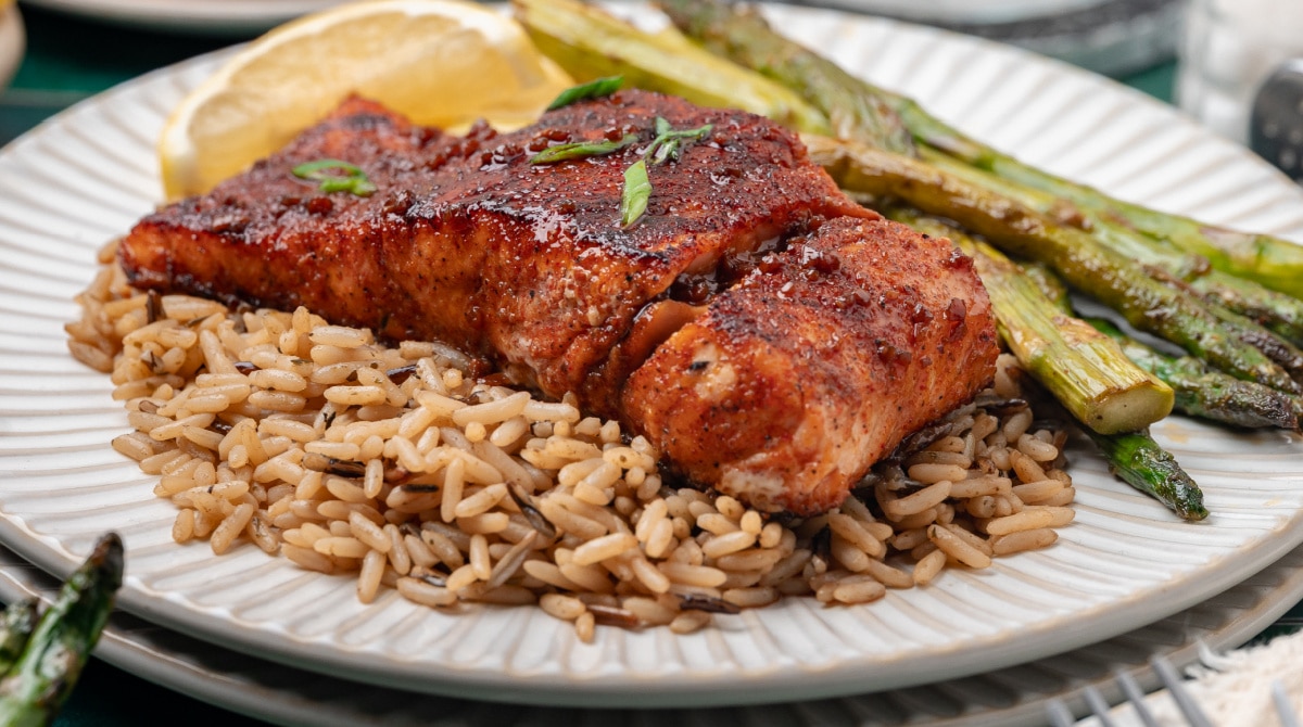 Bourbon Glazed Salmon with Rice and Asparagus bourbon glazed salmon served with a glossy brown sugar bourbon glaze and crisp seared finish