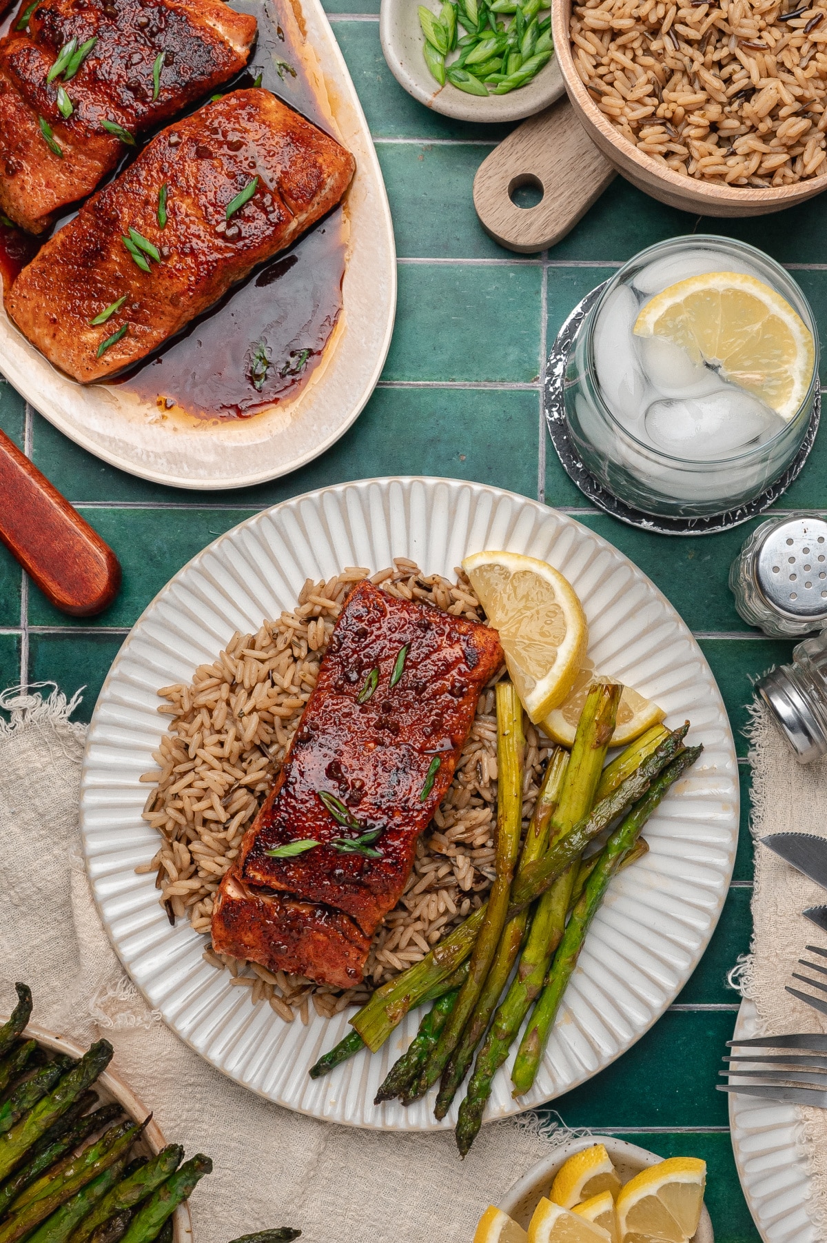 Bourbon Glazed Salmon Dinner Plate bourbon glazed salmon served with rice and roasted asparagus on a dinner plate