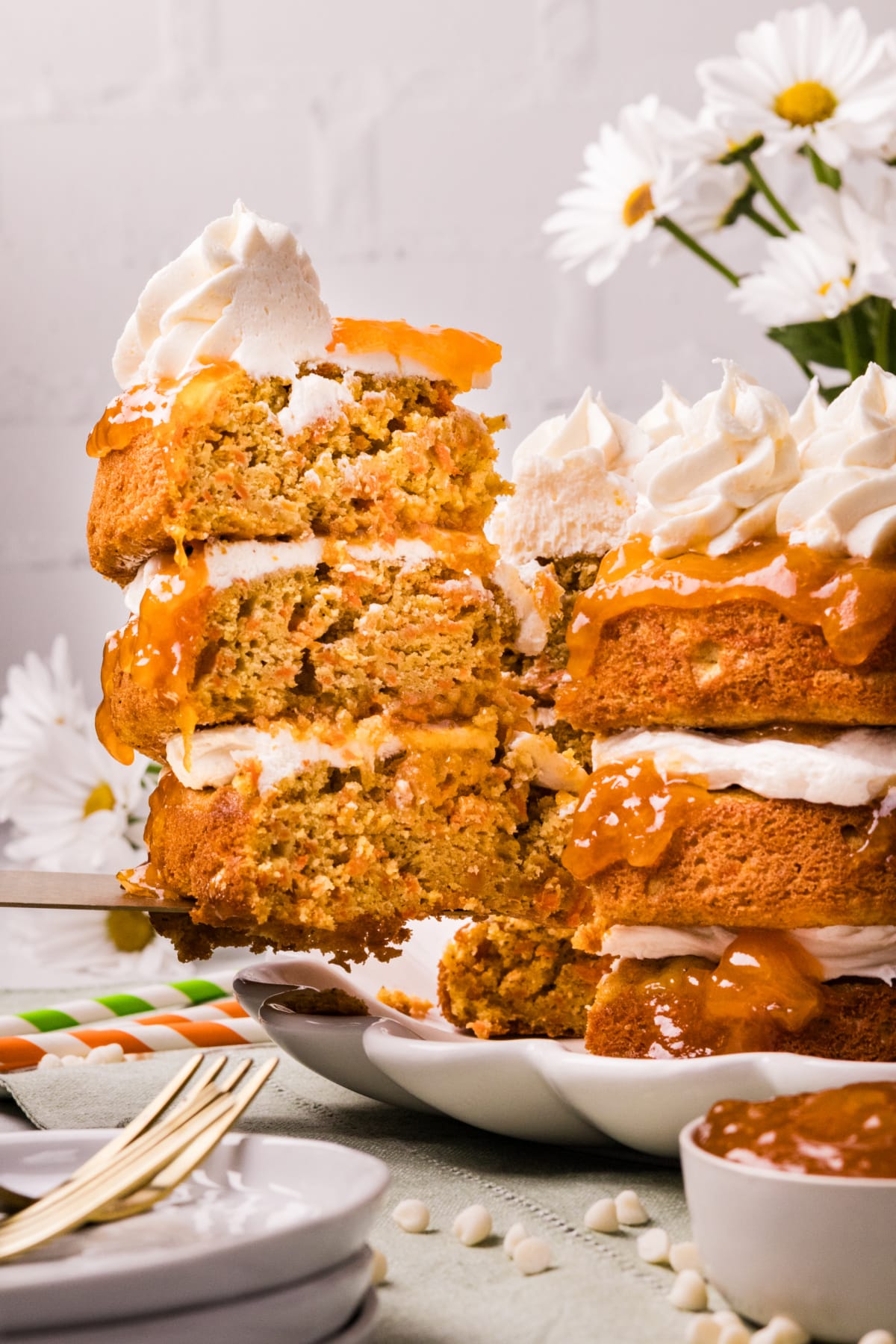Carrot Cake with Apricot Filling and White Chocolate Cream Cheese Frosting slice Slice of Carrot Cake with Apricot Filling and White Chocolate Cream Cheese Frosting showing moist crumb and layered filling
