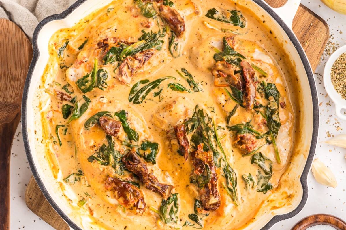 tuscan chicken with creamy parmesan sauce and spinach tuscan chicken in creamy parmesan sauce with sun-dried tomatoes and wilted spinach