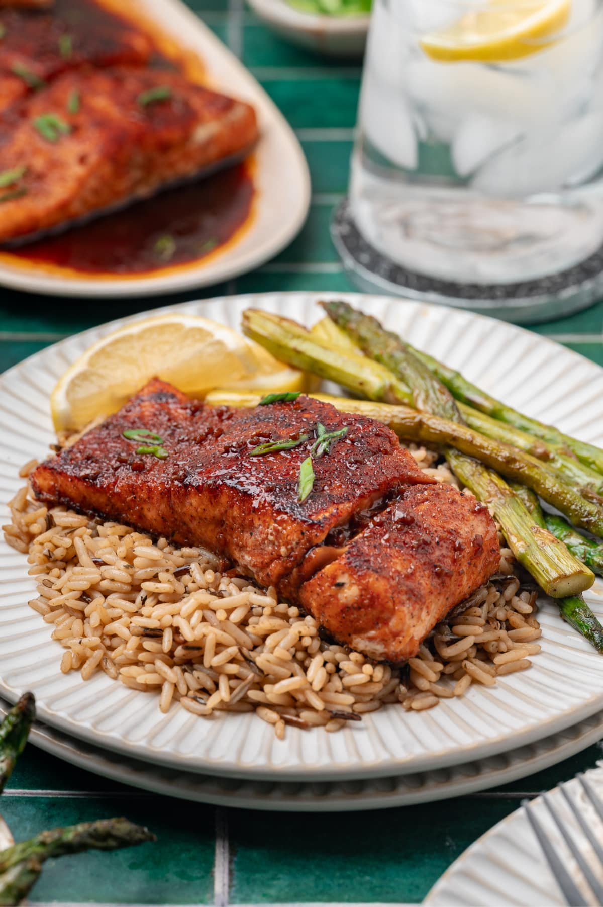 Glazed Salmon with Rice and Asparagus pan seared salmon with a glossy glaze served over rice with roasted asparagus and lemon