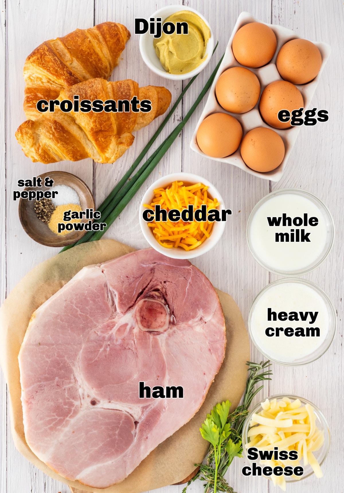 Ham and Cheese Croissant Breakfast Bake Ingredients ingredients for ham and cheese croissant breakfast bake including croissants, ham steak, eggs, milk, cream, shredded cheese, Dijon mustard, and chives