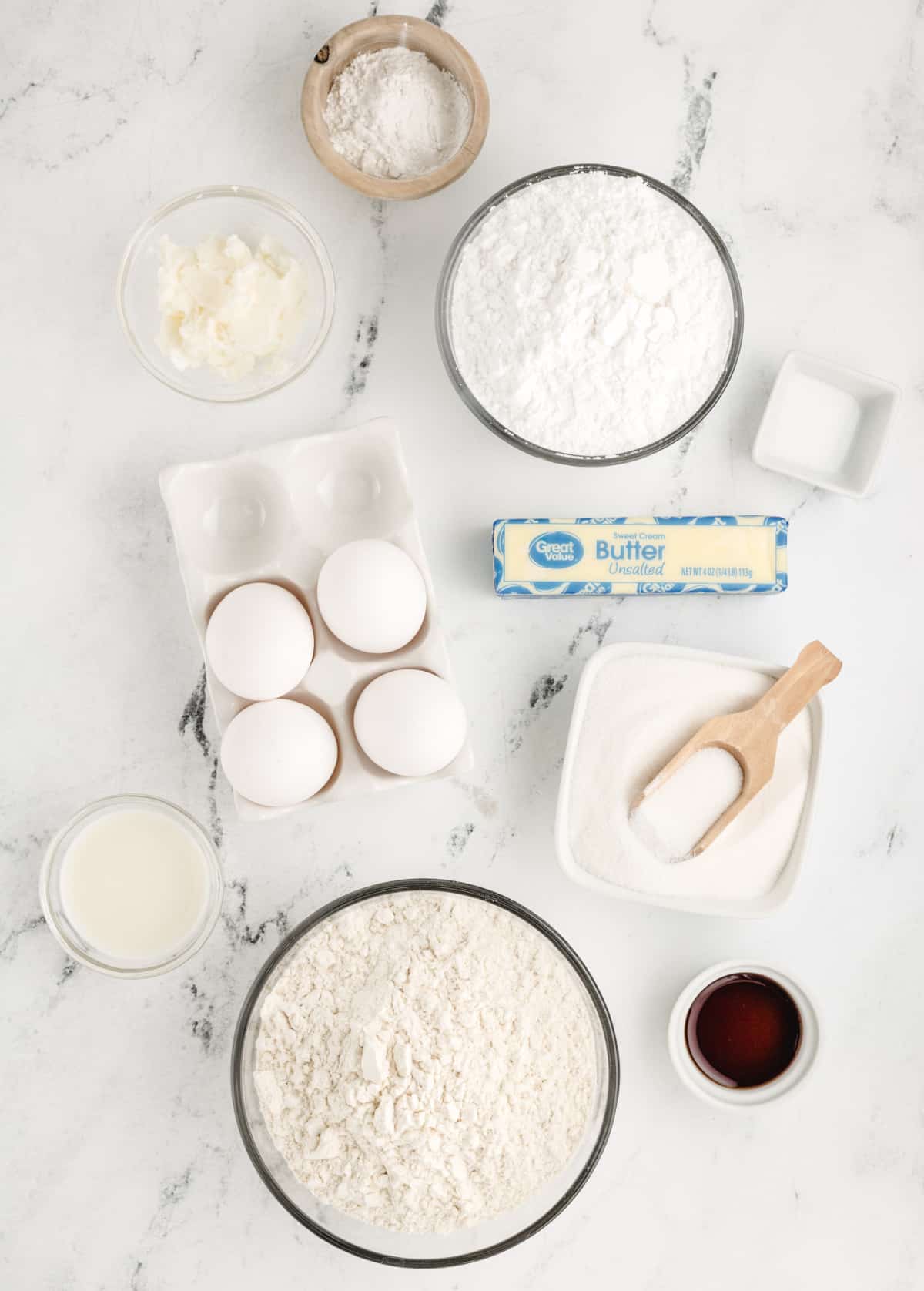 ingredients for Italian anise cookies including flour eggs butter sugar and anise extract