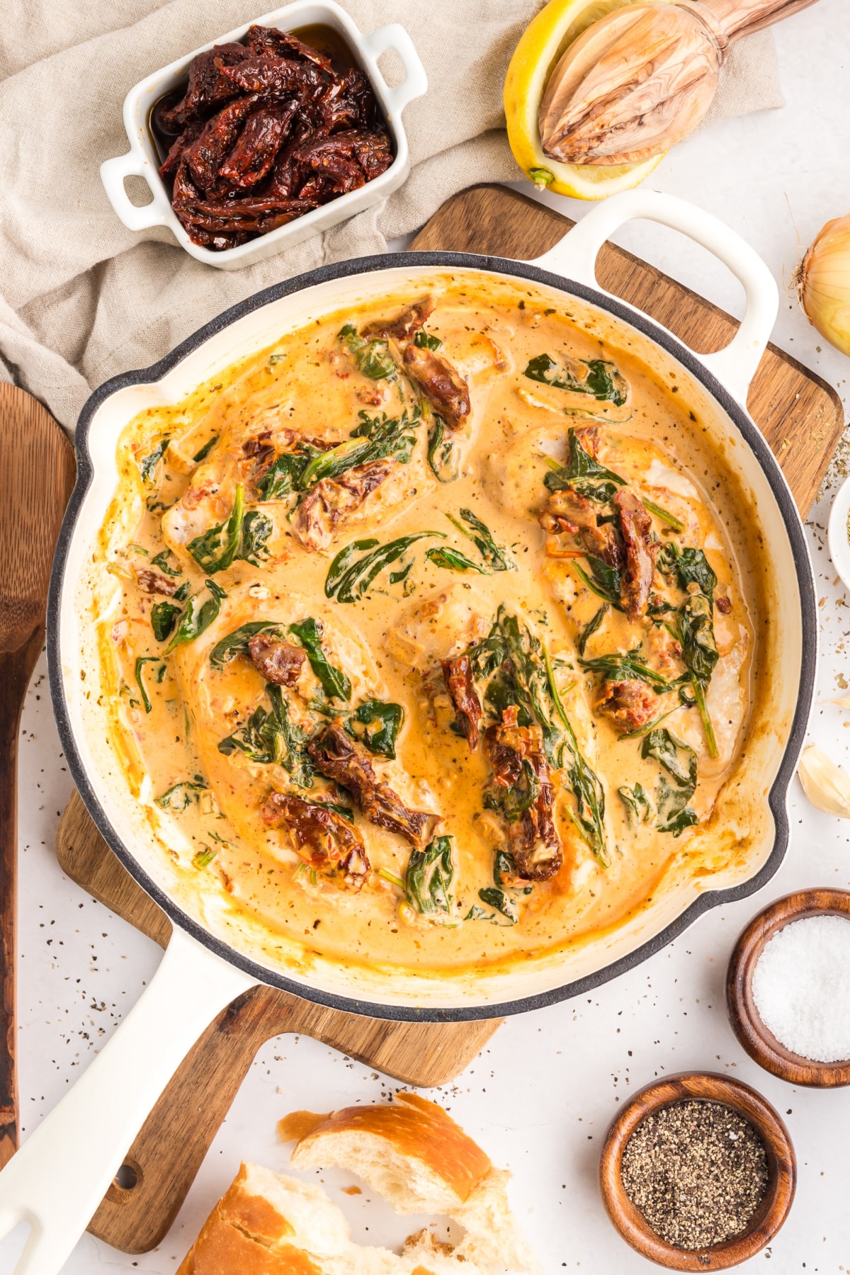 Marry Me Tuscan Chicken creamy skillet with sun-dried tomatoes Marry Me Tuscan Chicken in creamy parmesan sauce with sun-dried tomatoes and spinach in skillet