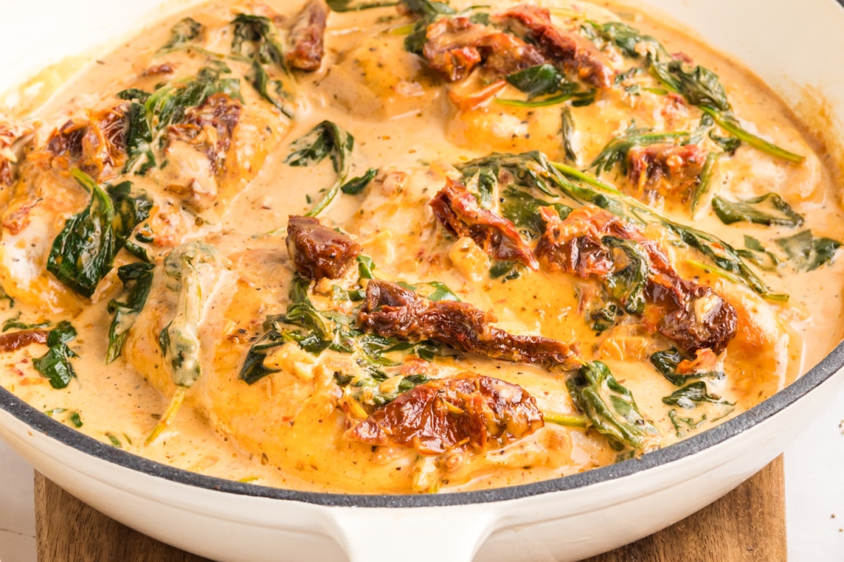 creamy tuscan chicken in skillet with sun-dried tomatoes creamy tuscan chicken in skillet with sun-dried tomatoes and spinach in parmesan sauce