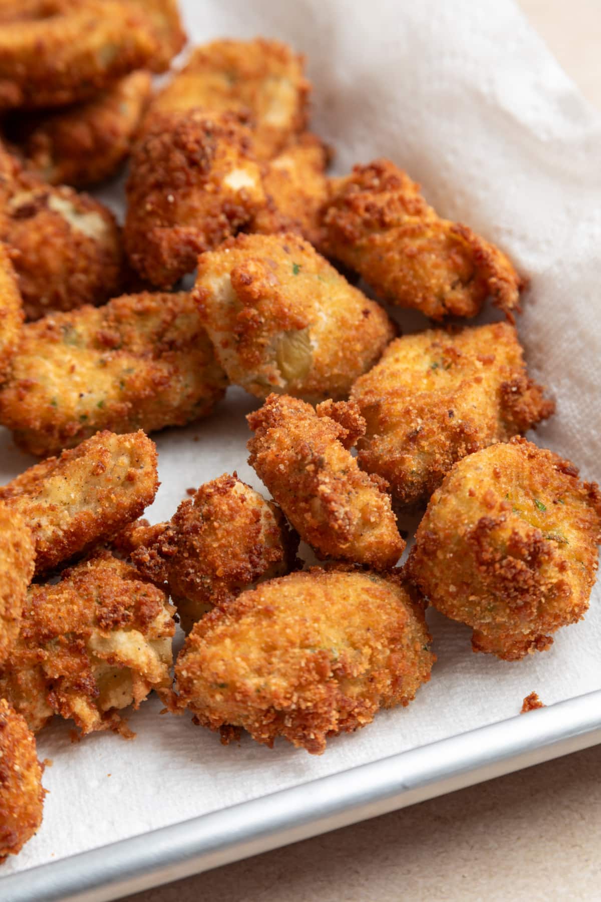 Crispy fried artichokes with a golden breadcrumb coating fresh from frying