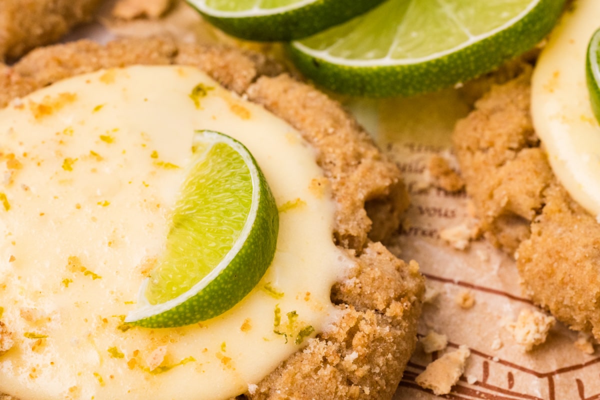 graham cracker cookie with creamy lime curd filling and fresh lime slice garnish