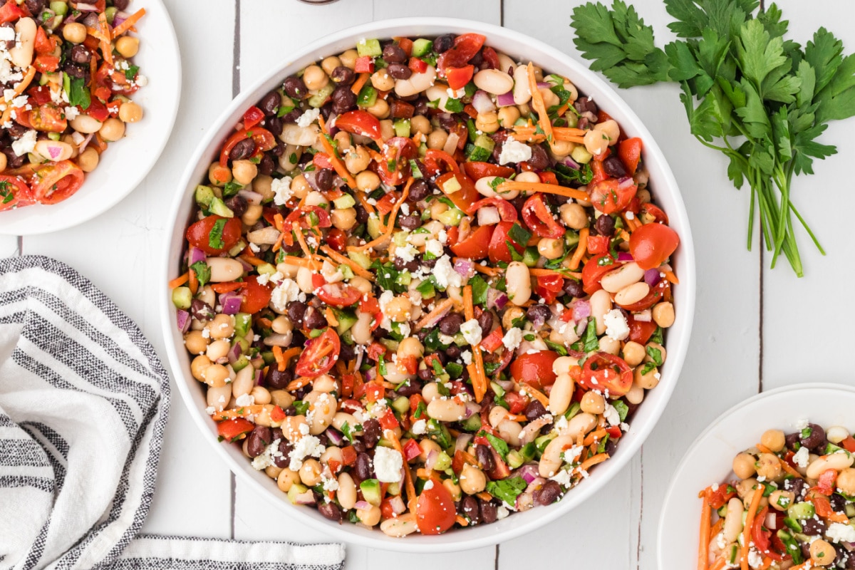 Chopped bean salad with feta cheese, chickpeas, black beans, cannellini beans, tomatoes, cucumber, and parsley