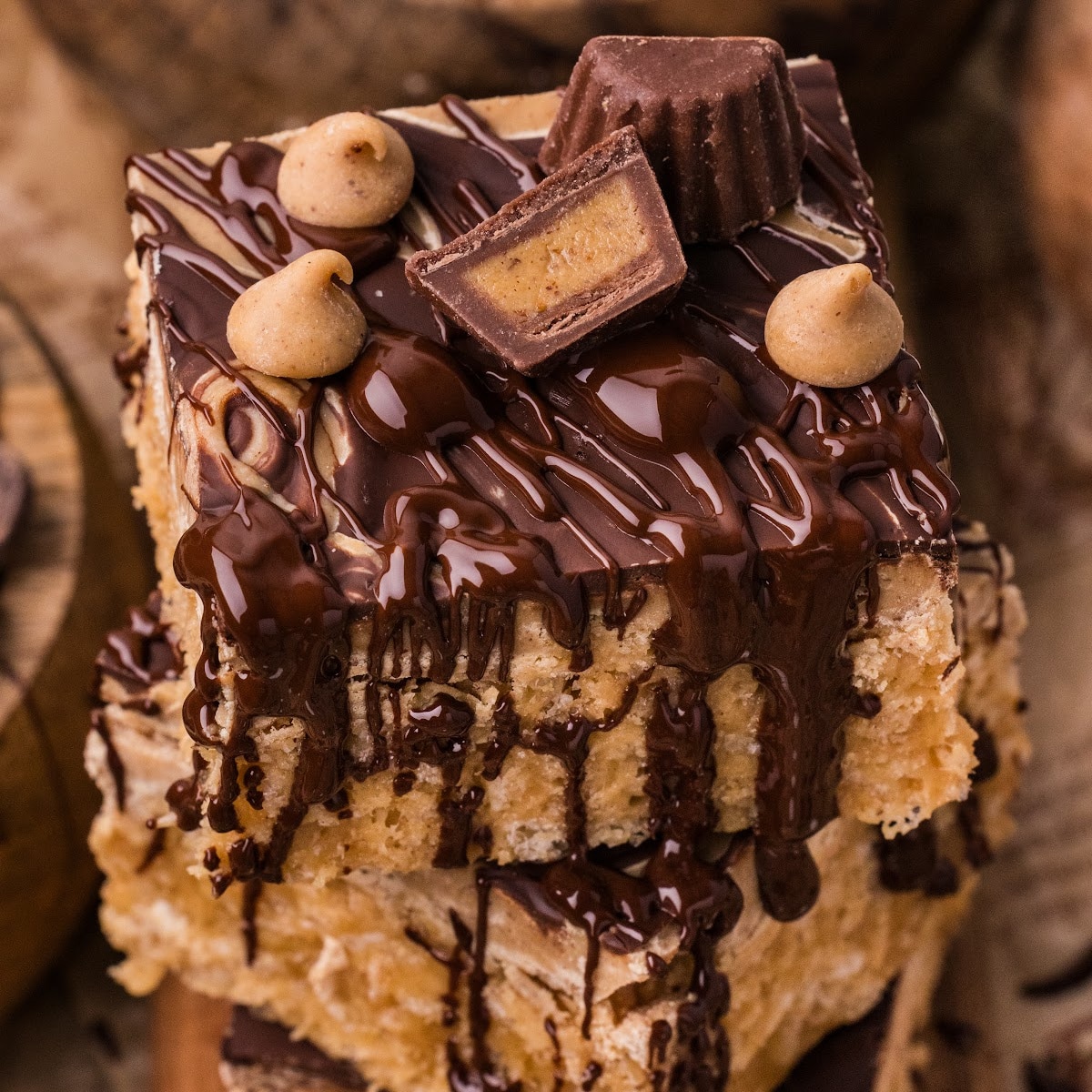 Bakery-style marbled peanut butter crunch bars stacked with chocolate drizzle and peanut butter cups