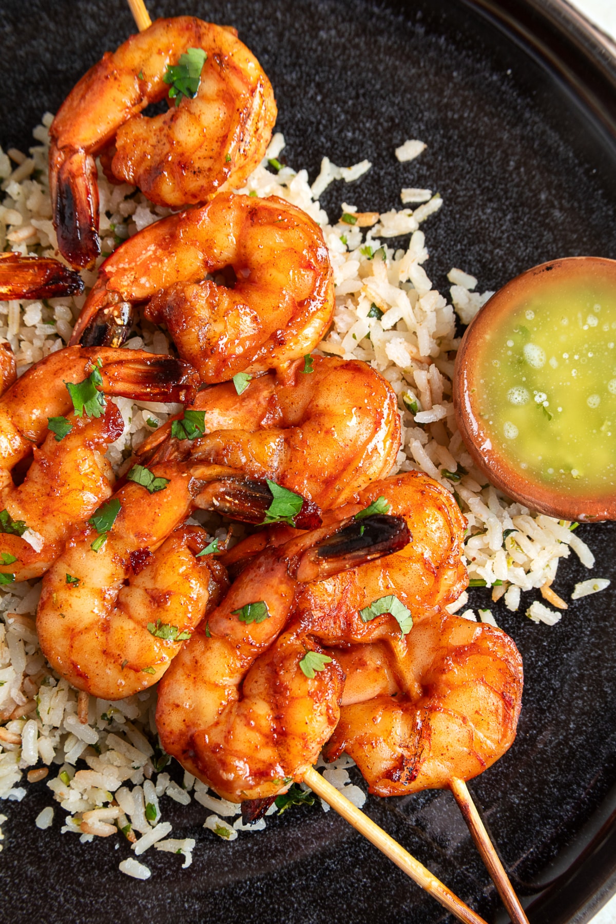 Chipotle honey grilled shrimp skewers served with cilantro lime rice and garlic lime butter