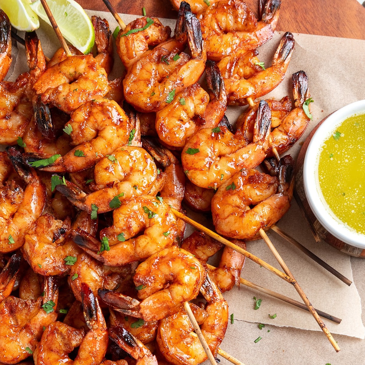 Close-up of grilled shrimp skewers coated in chipotle honey glaze