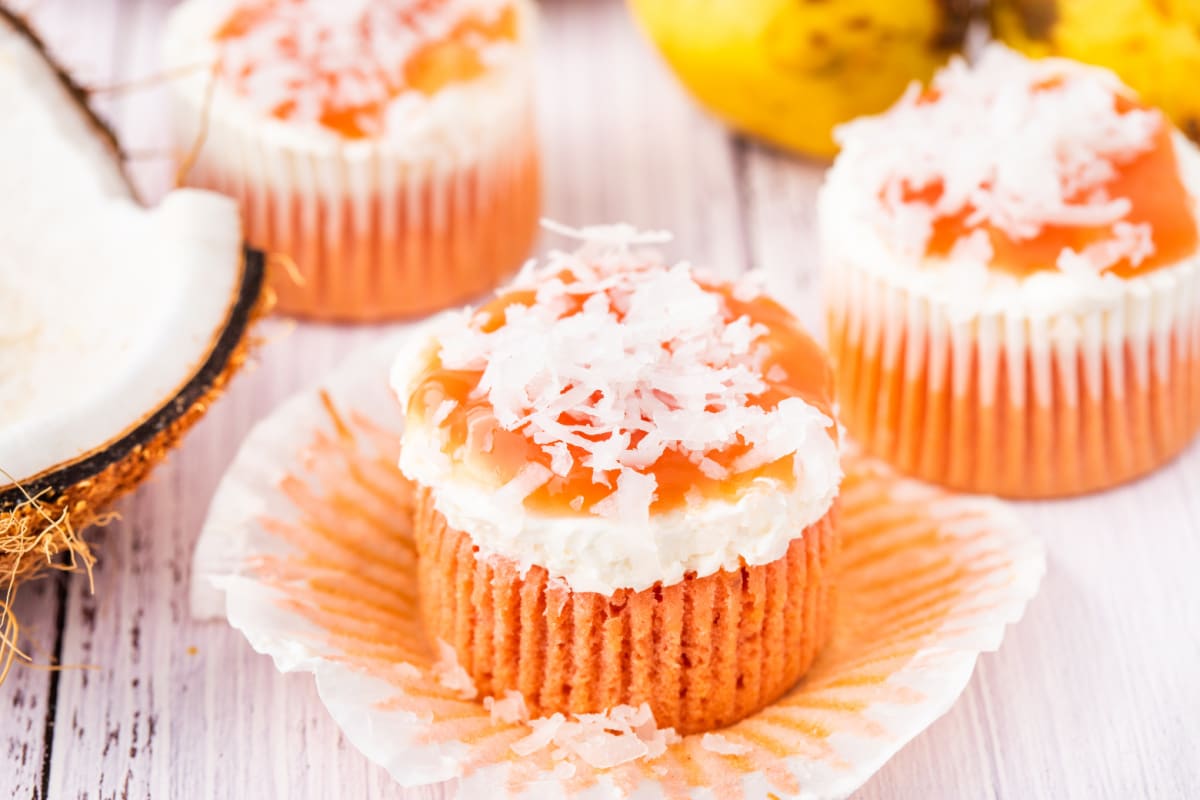 These guava cream cheese cupcakes are finished with a creamy topping, sweet guava glaze, and coconut. Hawaiian guava cake cupcakes topped with cream cheese frosting, guava glaze, and coconut