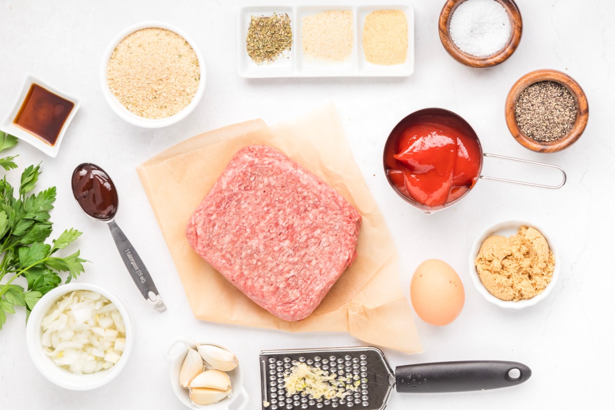 Mini meatloaf recipe ingredients measured and ready to prepare Ingredients for mini meatloaf recipe including ground beef, breadcrumbs, onion, ketchup, and seasonings