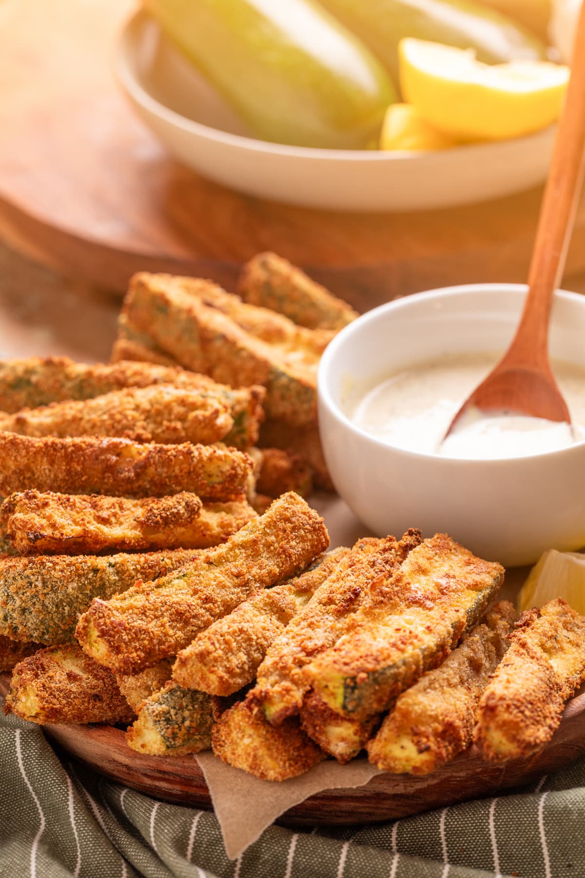 Air fryer zucchini fries with a crispy breadcrumb coating served with homemade lemon garlic aioli.