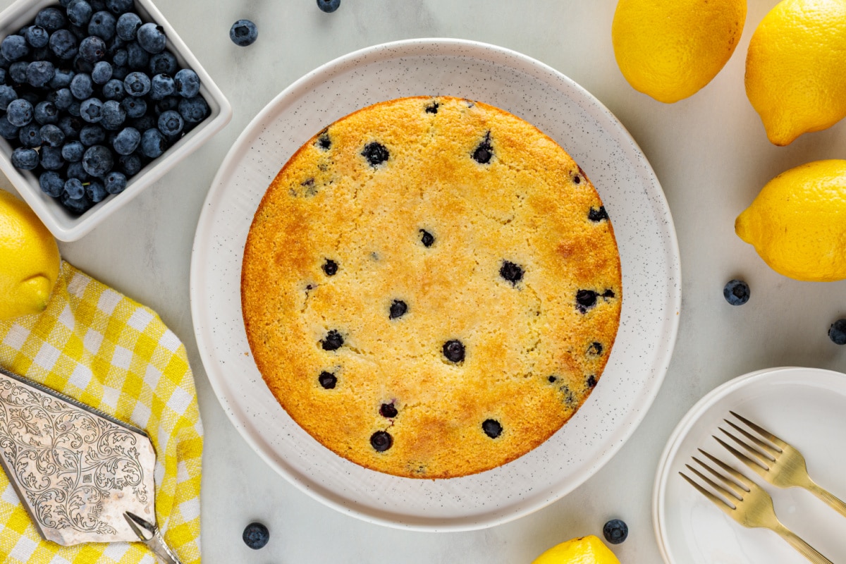 Overhead view of lemon blueberry cornbread baked until golden brown with fresh blueberries baked into the top.