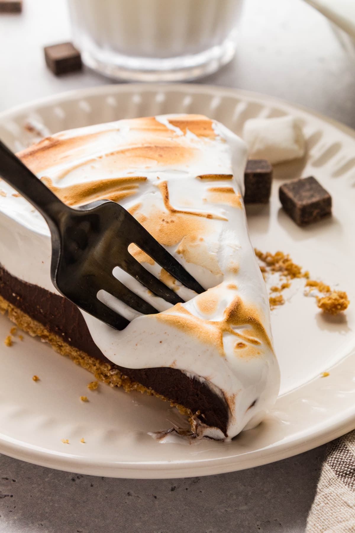 S'mores pie with chocolate ganache, homemade toasted marshmallow topping, and a graham cracker crust.