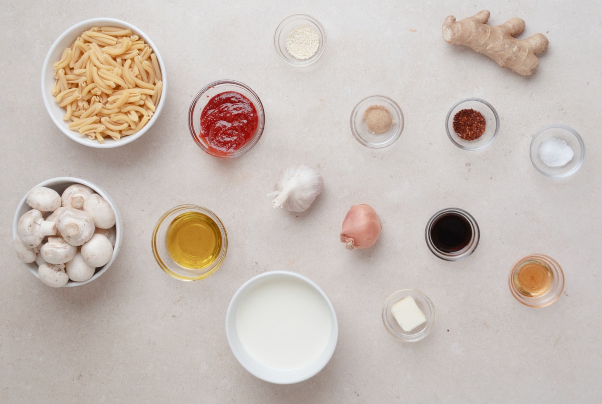 Ingredients for gochujang pasta including casarecce, mushrooms, gochujang, cream, garlic, ginger and gochugaru