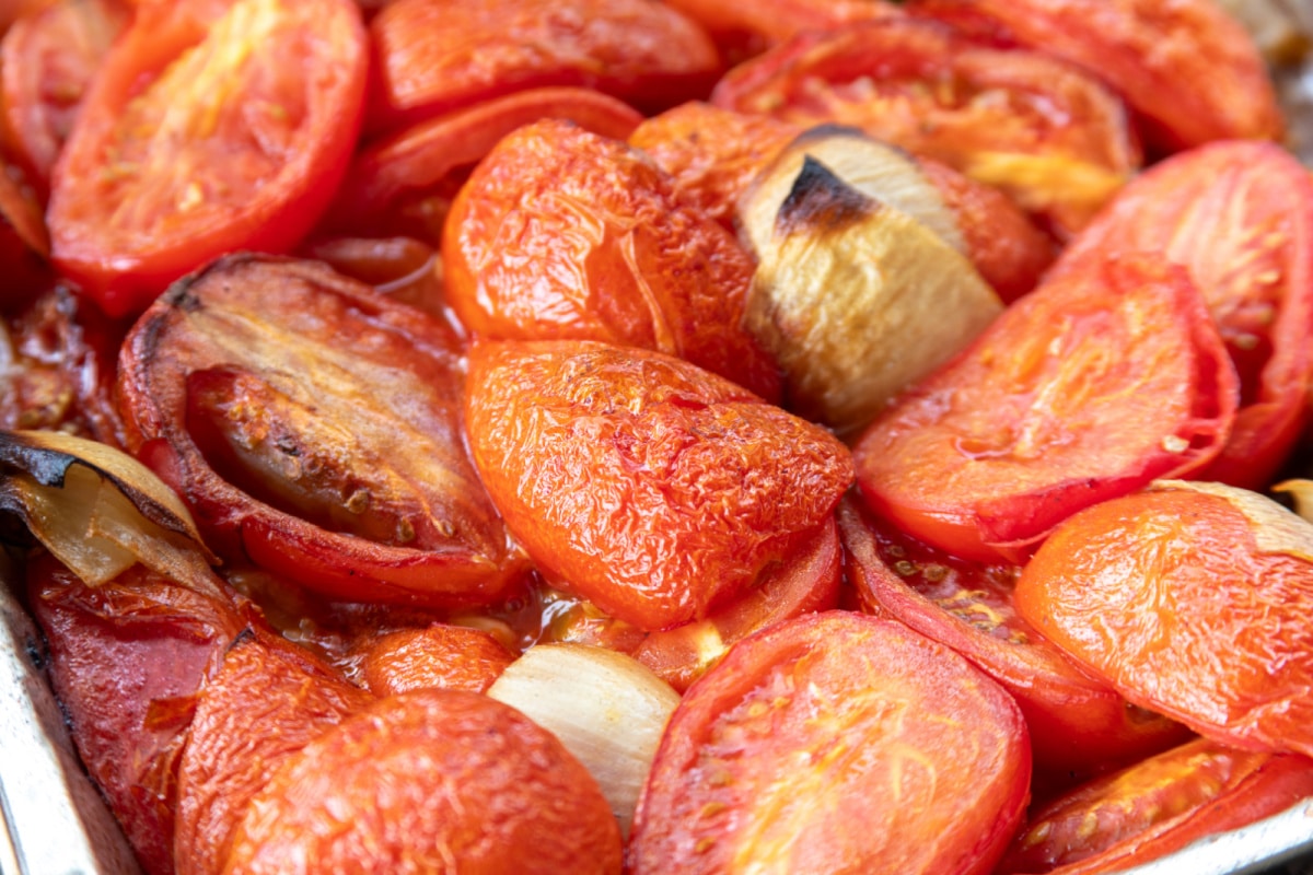 Smoked Roma tomatoes with charred onion and garlic ready to be blended for Bloody Mary mix
