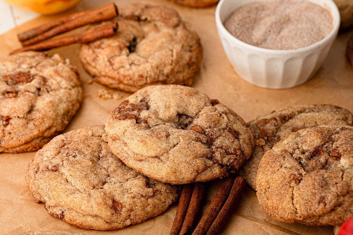 Thick apple snickerdoodles with pieces of cinnamon-spiced apple throughout