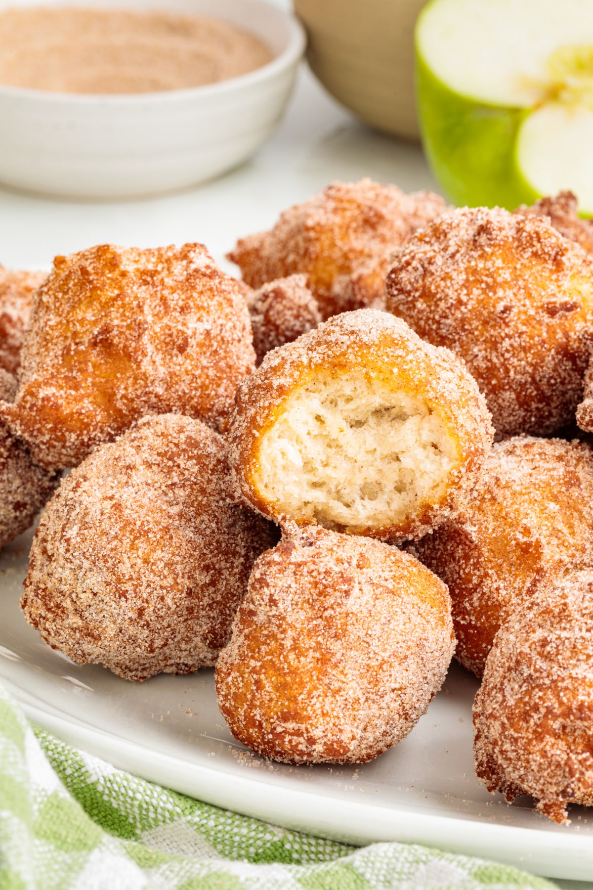 Applesauce fritter broken open to show the soft cooked center