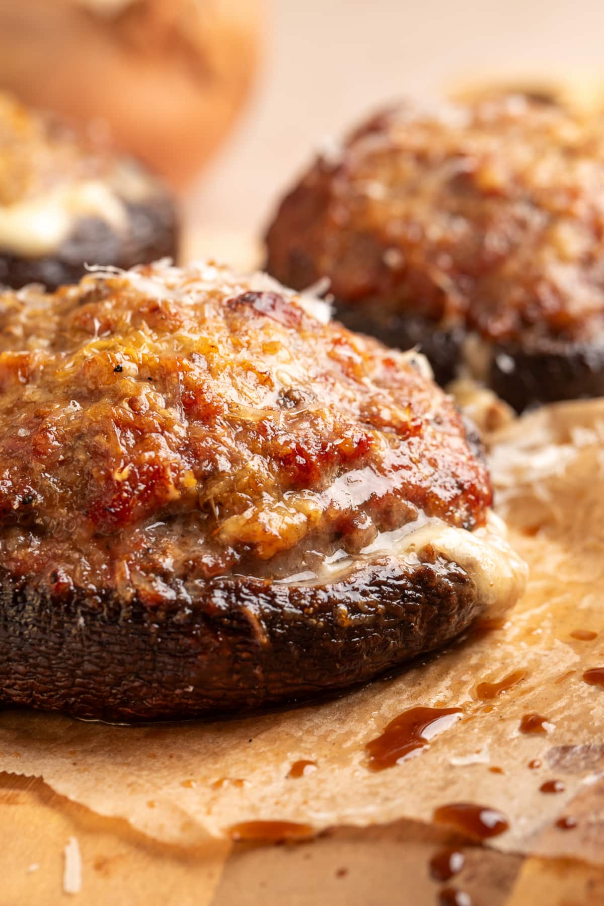 Grilled sausage stuffed portobello mushrooms with browned Parmesan and melted mozzarella