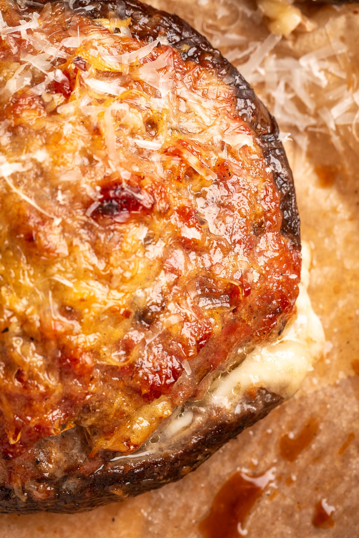 Sausage stuffed portobello mushroom with browned Parmesan and melted mozzarella underneath